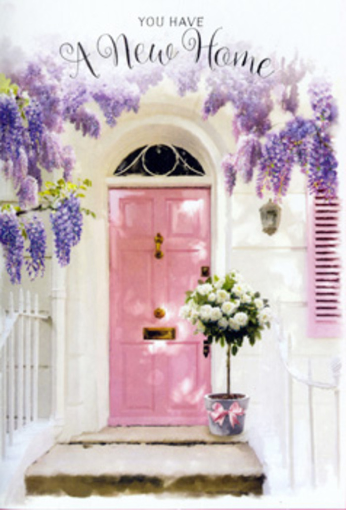 Standing before this Surbiton doorway, you can almost feel the gentle flutter of nerves and excitement that accompanies a move into a new home. The front door, painted in a delicate, powdery pink, forms the soft focal point of the scene, its panels catching the afternoon light that spills across the façade. Above and around it, wisteria branches unfurl in graceful arcs, draping the entrance with cascades of lavender blossoms. Each floral cluster hangs in loose, dangling sprays, creating a lilac curtain that both frames and partially shelters the doorway, much like the mature wisteria you might see climbing over characterful houses near St Andrew's Square. The surrounding walls are whitewashed and subtly textured, with a quietly painted shutter that picks up the same blush tones as the door, creating a cohesive, serene palette. At the doorstep sits a classic grey metal bucket, slightly weathered, its utilitarian form softened by the luxurious blooms it holds. Inside, rich white and cream roses are arranged in a lush, dome-like cluster, their velvety petals layered and full, interwoven with sprigs of freshly cut green foliage. A satin ribbon in soft pink cinches the bucket at its base, tied in a gentle bow that trails onto the stone step, echoing the door colour and adding a touch of romantic finesse. The light falls in dappled patterns, filtered through wisteria and casting soft shadows across the flowers and entrance. This is the sort of arrangement that feels perfect for a Surbiton housewarming gift, a floral gesture that quietly reassures and celebrates: welcoming a couple to their first flat, marking a family's move to a new street, and filling their threshold with beauty, hope, and the comforting sense that they have truly come home.